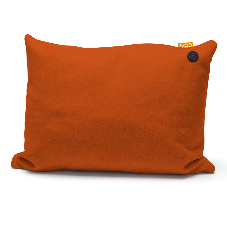 The COZY Heated Cushion Cordless - TOVE (60cm x 45cm) by Cozy Cushion EU is a rectangular orange pillow with a soft texture, a black circular button, and a yellow COZY tag—adding warmth and style cordlessly to any room.
