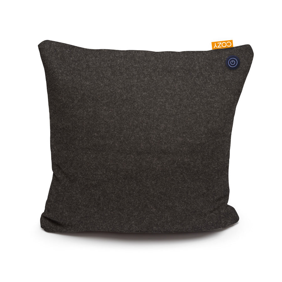 The COZY Heated Cushion Cordless - UNA (45cm x 45cm) by Cozy Cushion EU is a dark gray, square pillow with a small orange COZY tag and a circular power button icon, featuring infrared technology, shown on a plain white background.