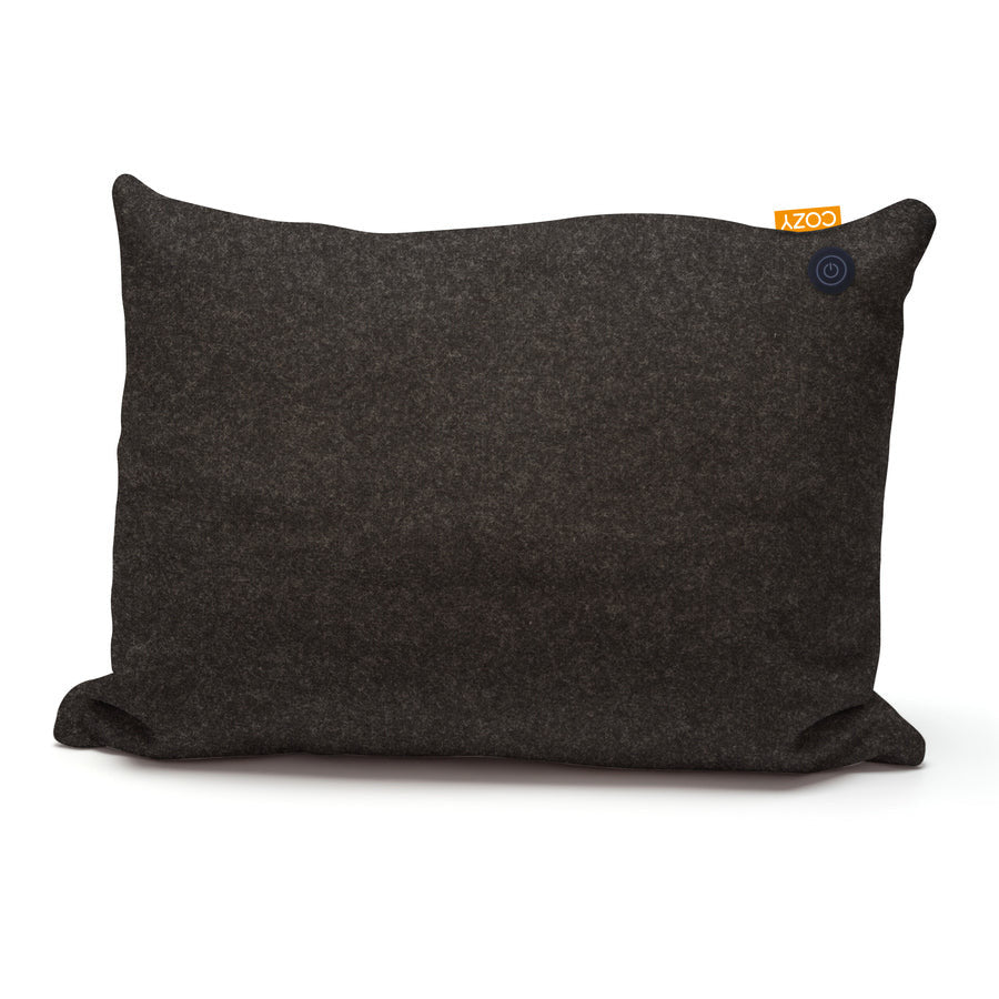 The COZY Heated Cushion Cordless - TOVE (60cm x 45cm) by Cozy Cushion is a rectangular, dark gray cushion with a small orange tag and a circular button on the top right corner, shown against a white background.