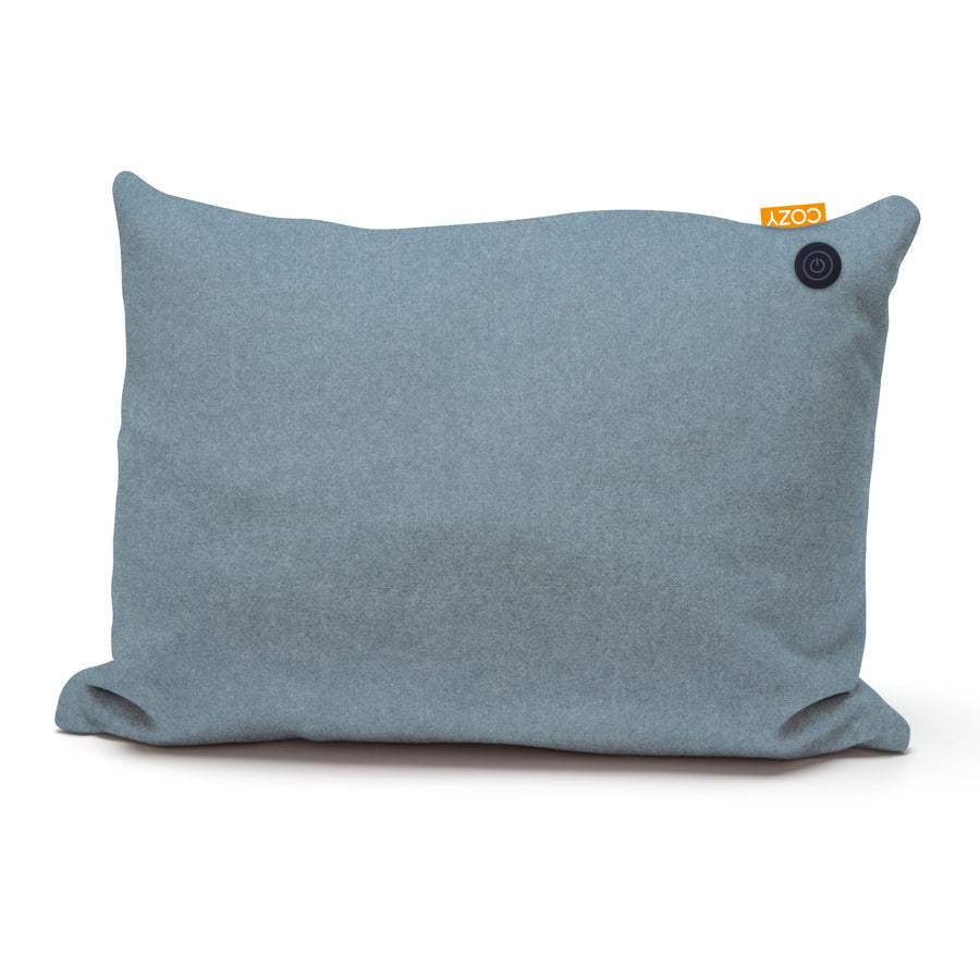 The COZY Heated Cushion Cordless - TOVE (60cm x 45cm) by Cozy Cushion is a rectangular light blue cushion with a small black circular button and an orange COZY tag in the top right corner, featuring a rechargeable battery, shown on a white background.