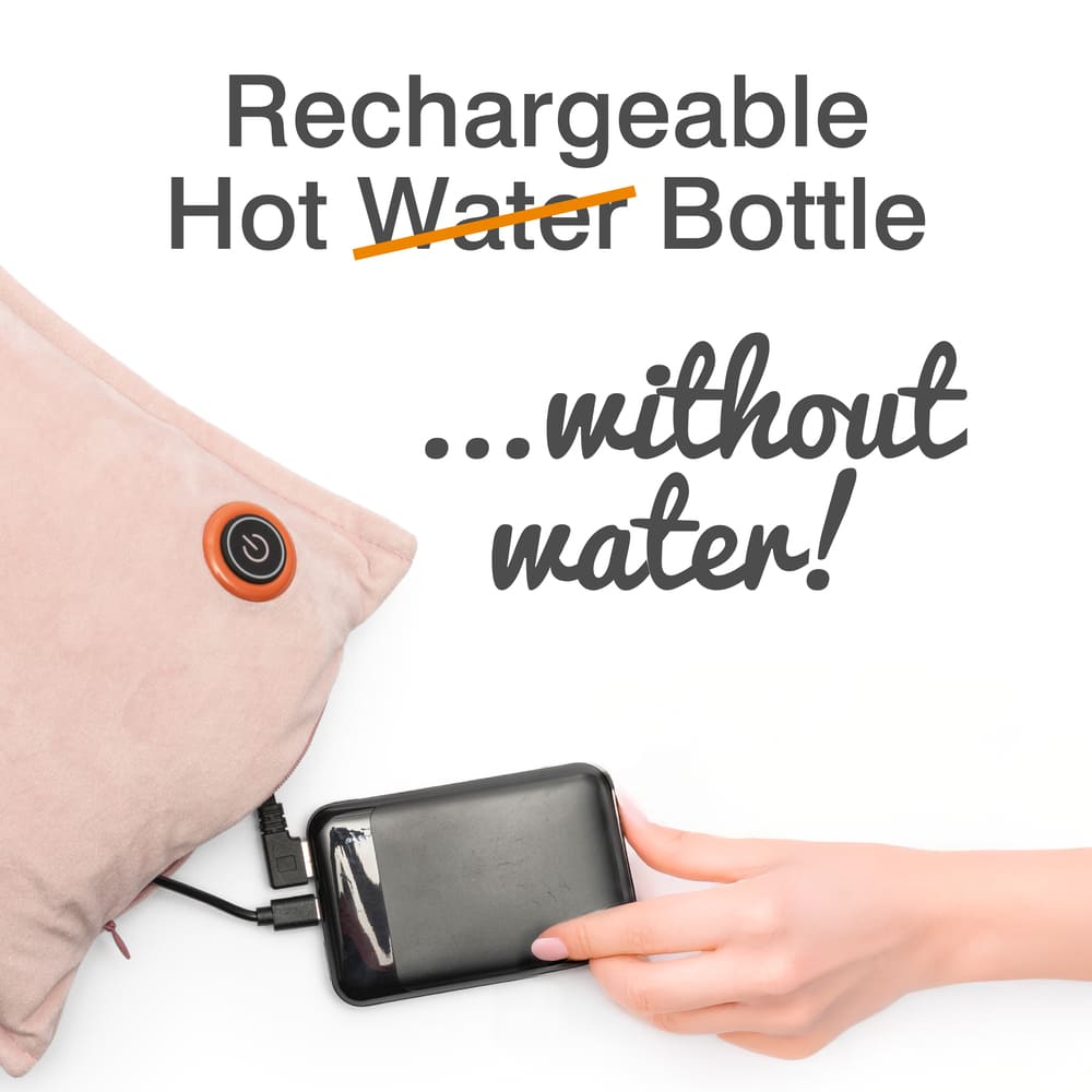 A hand plugs a power bank into the soft beige UNA Rechargeable Hot Water Bottle by Cozy Cushion EU, featuring a power button. Text reads: "Rechargeable Hot Water Bottle...without water! Enjoy wireless warmth anywhere you go!.