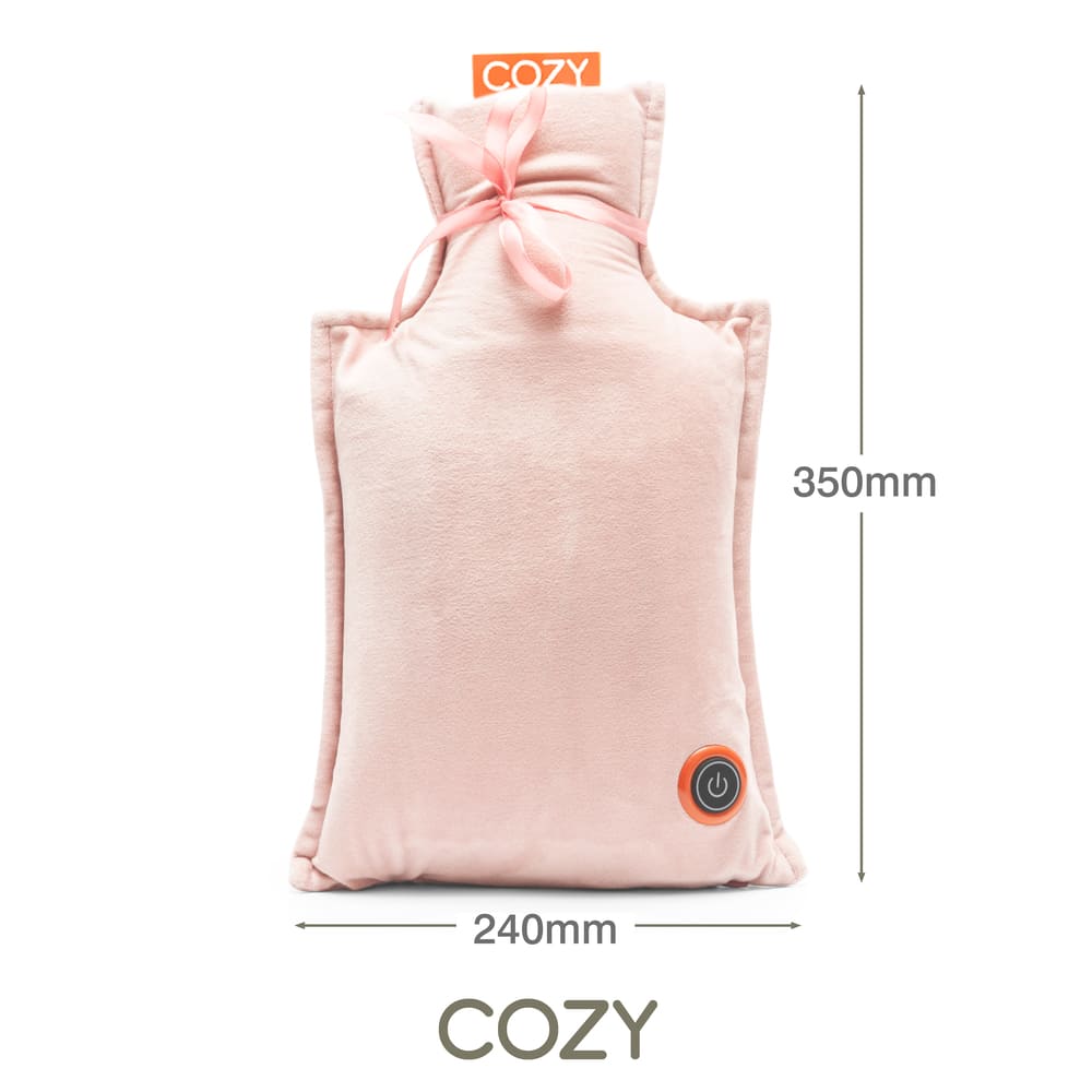 A soft, light pink rectangular UNA Rechargeable Hot Water Bottle by Cozy Cushion EU features a ribbon tie at the top, power button icon on the lower right, 240mm x 350mm size, and "COZY" printed above and below this wireless warmth pillow.
